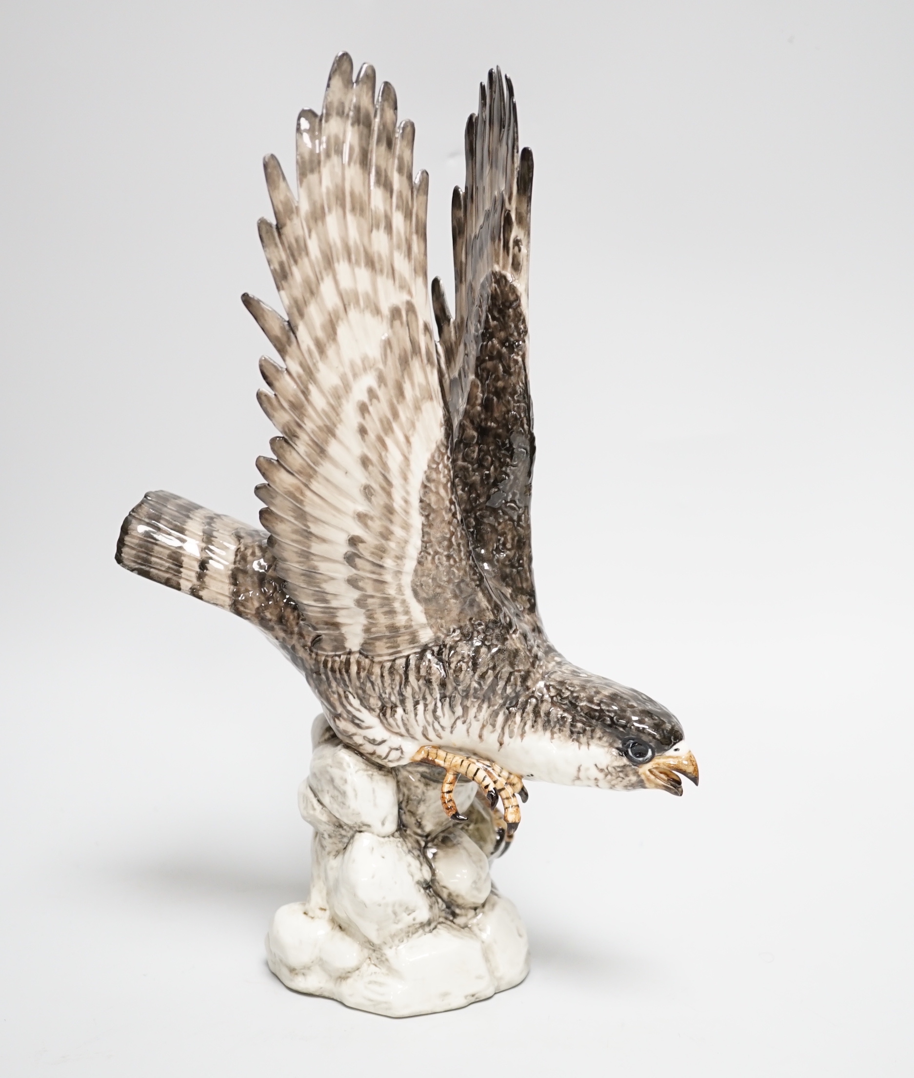 A Spanish porcelain falcon, with ‘PM’ mark to base and ‘Syra P. Garcia 43 Barcelona’ applied label, 30.5cm high